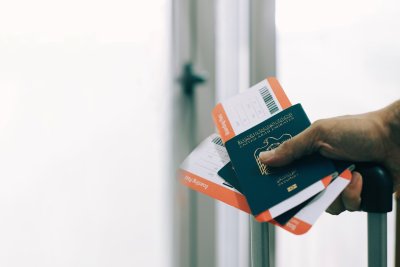 Passenger Holding Uae Passports And Airline Tickets In Airport